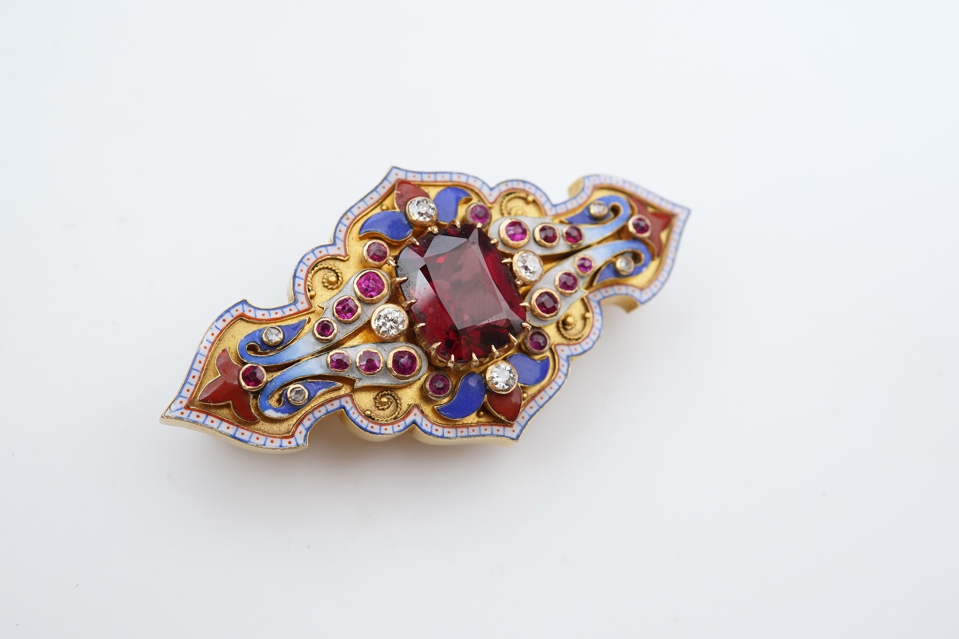 A fine Victorian Renaissance Revival tourmaline, diamond, ruby and enamel brooch, late 19th century